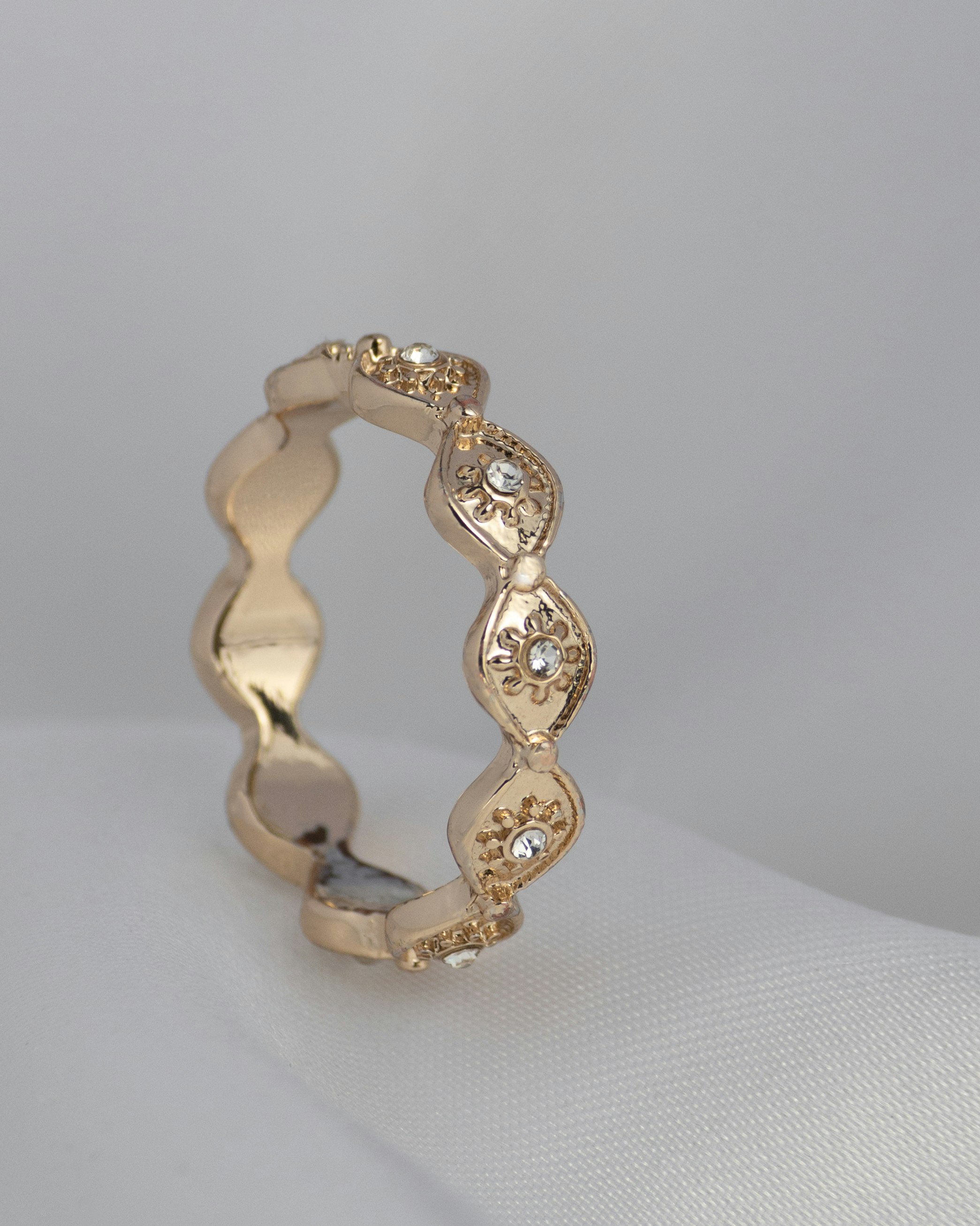 A rose-gold band set with brilliant-cut diamonds